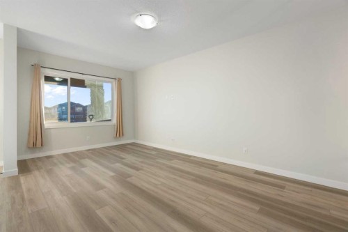 99 Edith Passage Nw, Calgary, AB - Indoor Photo Showing Other Room