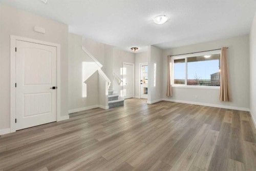 99 Edith Passage Nw, Calgary, AB - Indoor Photo Showing Other Room