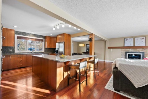 612 Willoughby Crescent Se, Calgary, AB - Indoor Photo Showing Kitchen With Fireplace