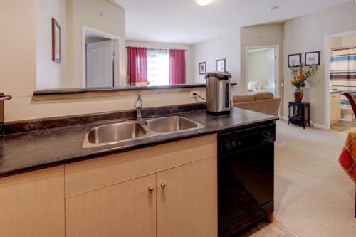 1413-1140 Taradale Drive Ne, Calgary, AB - Indoor Photo Showing Kitchen With Double Sink
