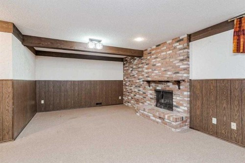330 Oakwood Place Sw, Calgary, AB - Indoor With Fireplace