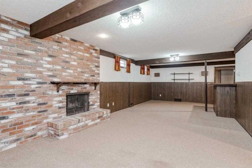 330 Oakwood Place Sw, Calgary, AB - Indoor Photo Showing Other Room With Fireplace
