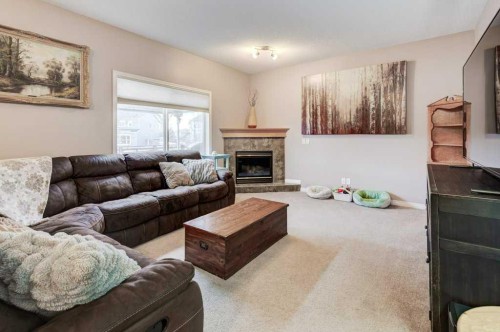 1024 Ranch Road, Okotoks, AB - Indoor Photo Showing Living Room With Fireplace