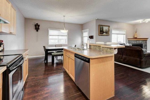 1024 Ranch Road, Okotoks, AB - Indoor Photo Showing Kitchen With Fireplace