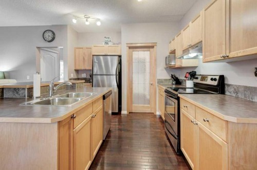 1024 Ranch Road, Okotoks, AB - Indoor Photo Showing Kitchen With Double Sink