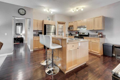 1024 Ranch Road, Okotoks, AB - Indoor Photo Showing Kitchen With Stainless Steel Kitchen With Double Sink