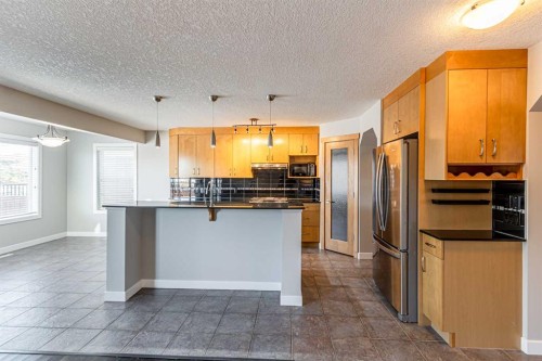 173 Silverado Plains Close Sw, Calgary, AB - Indoor Photo Showing Kitchen