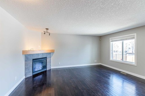 173 Silverado Plains Close Sw, Calgary, AB - Indoor With Fireplace