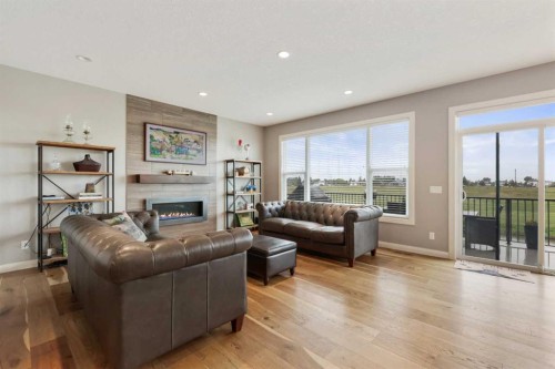 260 Boulder Creek Crescent Se, Langdon, AB - Indoor Photo Showing Living Room With Fireplace