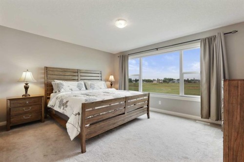 260 Boulder Creek Crescent Se, Langdon, AB - Indoor Photo Showing Bedroom