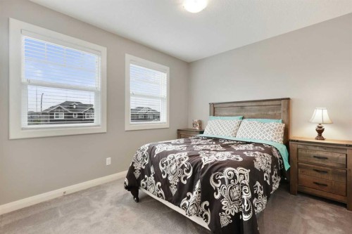 260 Boulder Creek Crescent Se, Langdon, AB - Indoor Photo Showing Bedroom