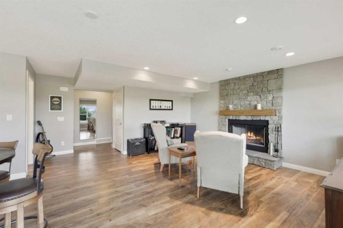 260 Boulder Creek Crescent Se, Langdon, AB - Indoor With Fireplace