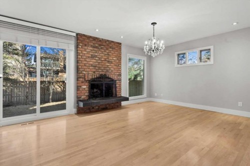 15 Oakmount Place Sw, Calgary, AB - Indoor Photo Showing Living Room With Fireplace