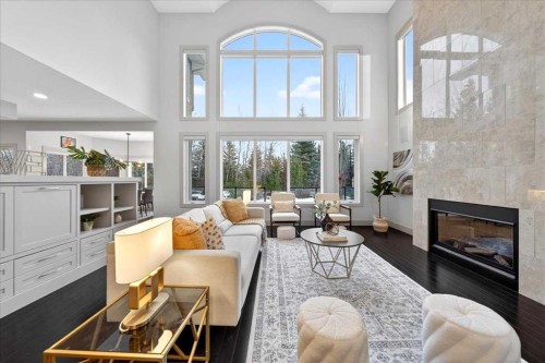 10 Discovery Ridge Way Sw, Calgary, AB - Indoor Photo Showing Living Room With Fireplace