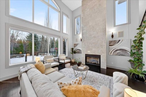 10 Discovery Ridge Way Sw, Calgary, AB - Indoor Photo Showing Living Room With Fireplace