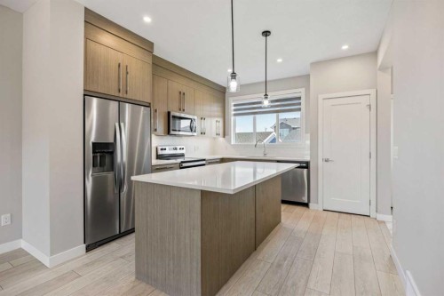 204 Chelsea Manor, Chestermere, AB - Indoor Photo Showing Kitchen With Stainless Steel Kitchen With Upgraded Kitchen