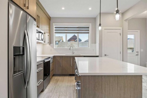 204 Chelsea Manor, Chestermere, AB - Indoor Photo Showing Kitchen With Stainless Steel Kitchen With Upgraded Kitchen