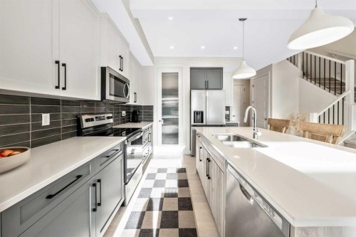 84 Mill Road, Cochrane, AB - Indoor Photo Showing Kitchen With Double Sink With Upgraded Kitchen