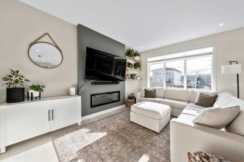 84 Mill Road, Cochrane, AB - Indoor Photo Showing Living Room With Fireplace