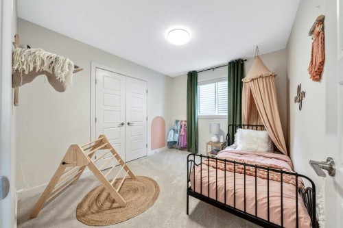 84 Mill Road, Cochrane, AB - Indoor Photo Showing Bedroom