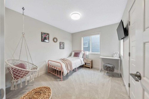 84 Mill Road, Cochrane, AB - Indoor Photo Showing Bedroom