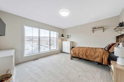 84 Mill Road, Cochrane, AB - Indoor Photo Showing Bedroom