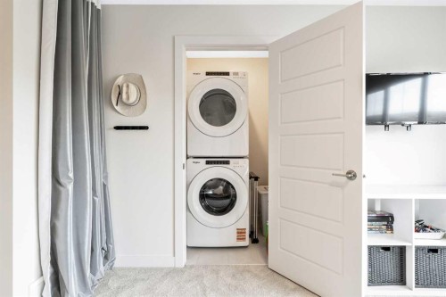 84 Mill Road, Cochrane, AB - Indoor Photo Showing Laundry Room