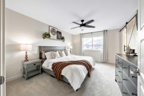 84 Mill Road, Cochrane, AB - Indoor Photo Showing Bedroom