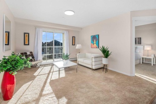 1305-755 Copperpond Boulevard Se, Calgary, AB - Indoor Photo Showing Living Room