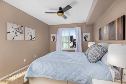 1305-755 Copperpond Boulevard Se, Calgary, AB - Indoor Photo Showing Bedroom