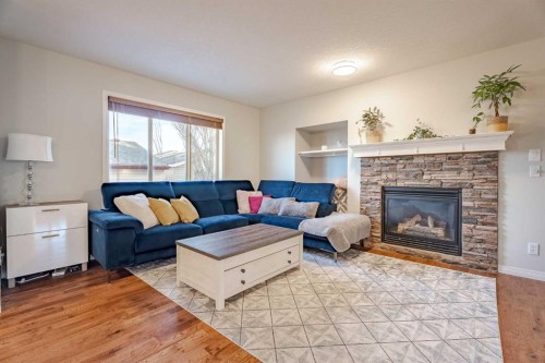 42 Bridlecrest Gardens Sw, Calgary, AB - Indoor Photo Showing Living Room With Fireplace