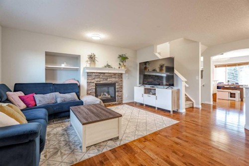 42 Bridlecrest Gardens Sw, Calgary, AB - Indoor Photo Showing Living Room With Fireplace