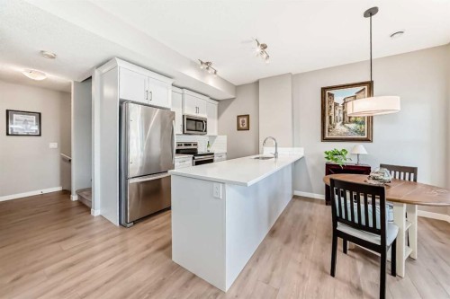 803-250 Fireside View, Cochrane, AB - Indoor Photo Showing Kitchen With Stainless Steel Kitchen