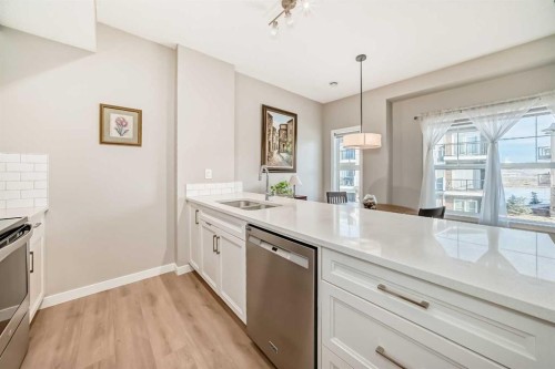 803-250 Fireside View, Cochrane, AB - Indoor Photo Showing Kitchen With Double Sink