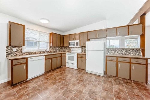 6527 58 Street Nw, Calgary, AB - Indoor Photo Showing Kitchen With Double Sink