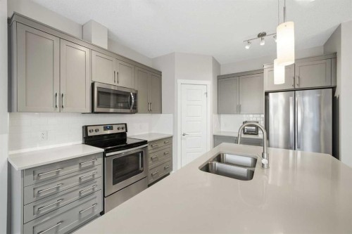 71 Sage Bluff Heights Nw, Calgary, AB - Indoor Photo Showing Kitchen With Stainless Steel Kitchen With Double Sink With Upgraded Kitchen