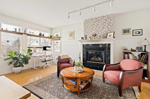 926 8 Avenue Se, Calgary, AB - Indoor Photo Showing Living Room With Fireplace