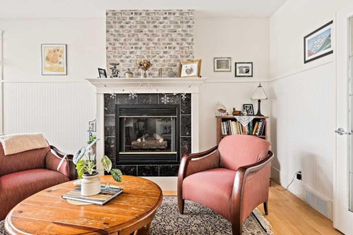 926 8 Avenue Se, Calgary, AB - Indoor Photo Showing Living Room With Fireplace