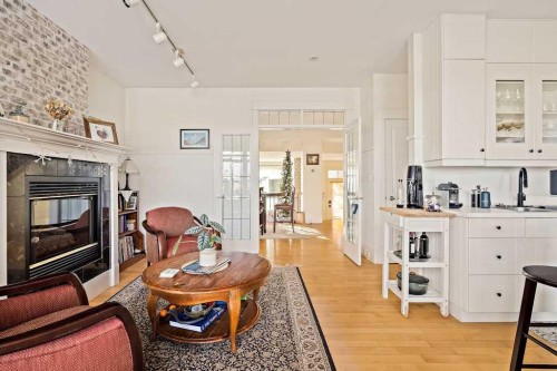 926 8 Avenue Se, Calgary, AB - Indoor Photo Showing Living Room With Fireplace