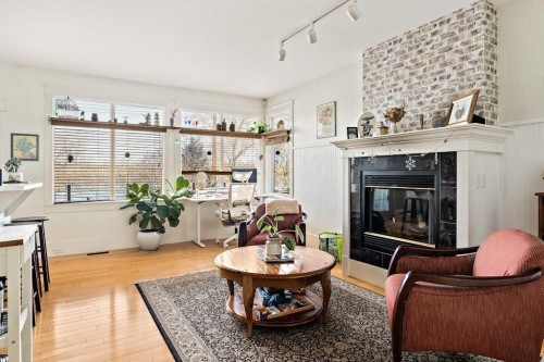 926 8 Avenue Se, Calgary, AB - Indoor Photo Showing Living Room With Fireplace