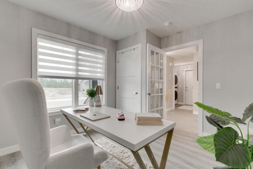 185 Riverwood Crescent, Diamond Valley, AB - Indoor Photo Showing Living Room