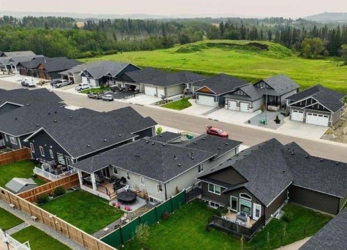 185 Riverwood Crescent, Diamond Valley, AB - Outdoor With Deck Patio Veranda With Exterior