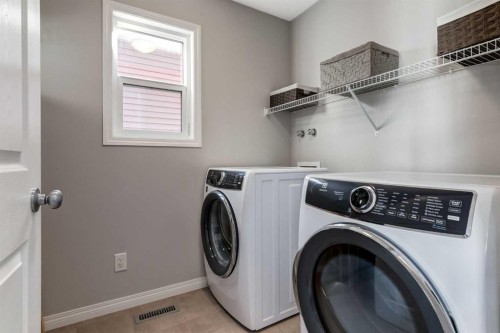 36 Sundown Common, Cochrane, AB - Indoor Photo Showing Laundry Room