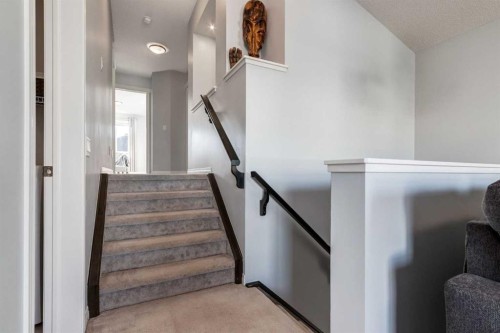 36 Sundown Common, Cochrane, AB - Indoor Photo Showing Other Room