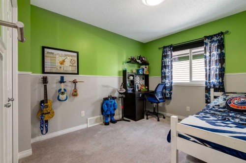 36 Sundown Common, Cochrane, AB - Indoor Photo Showing Bedroom