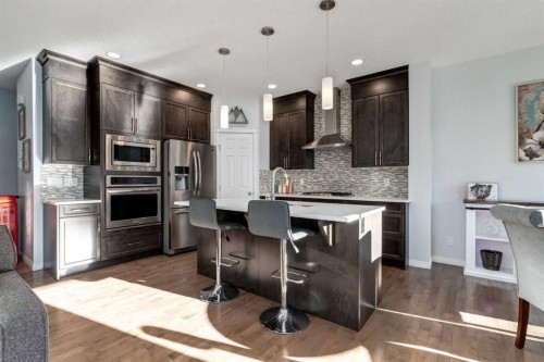 36 Sundown Common, Cochrane, AB - Indoor Photo Showing Kitchen With Stainless Steel Kitchen With Upgraded Kitchen