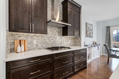 36 Sundown Common, Cochrane, AB - Indoor Photo Showing Kitchen With Upgraded Kitchen