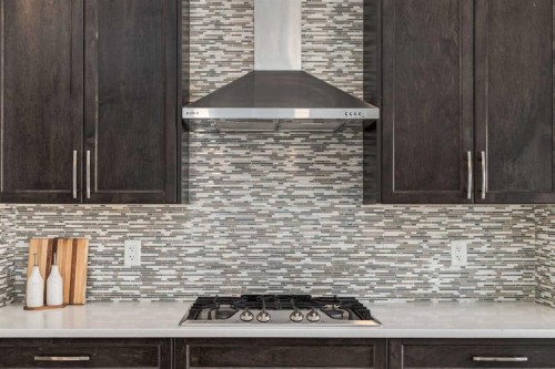 36 Sundown Common, Cochrane, AB - Indoor Photo Showing Kitchen With Upgraded Kitchen