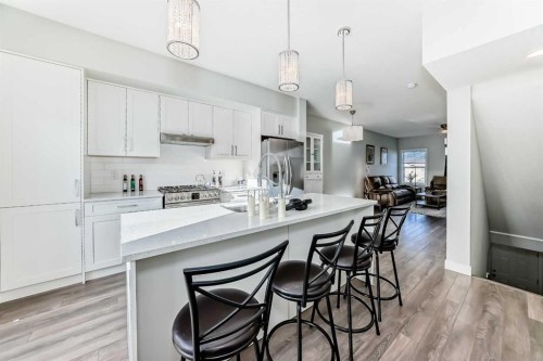 2306 Jumping Pound Common, Cochrane, AB - Indoor Photo Showing Kitchen With Upgraded Kitchen