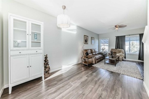 2306 Jumping Pound Common, Cochrane, AB - Indoor Photo Showing Living Room